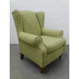 Wing armchair upholstered with a stylish pale green chequered wool fabric, on wooden legs, 102 x