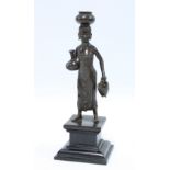 Bronze figure of a female water carrier, 24cm.