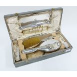 George V silver backed dressing table set with hand mirror, hair brush, two clothes brushes and a