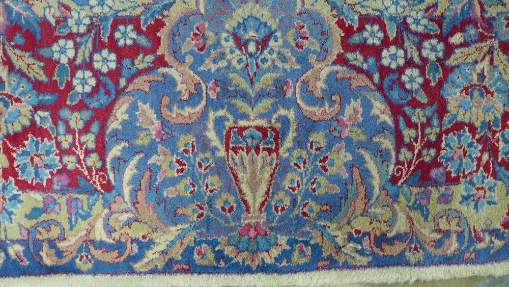 Large Indian carpet, probably Agra, ivory and pale blue field with urns and flowers design, 305 x - Image 5 of 9