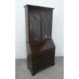 19th century mahogany bookcase cabinet, with stepped cornice top over a pair of astragal glazed