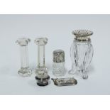 George VI silver topped glass castor, two glass knife rests and an Edwardian silver topped scent