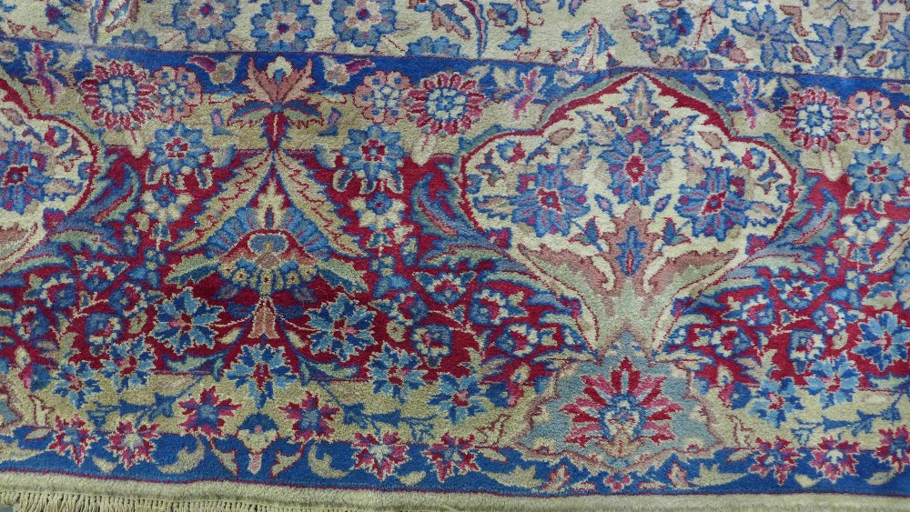 Large Indian carpet, probably Agra, ivory and pale blue field with urns and flowers design, 305 x - Image 9 of 9