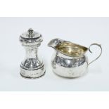 George V silver cream jug, Birmingham 1911 and an Edwardian silver pepper grinder, Chester 1904 (2)
