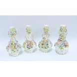 Four Coalbrookdale type floral encrusted vases, (4) (some loses to petals, etc) 21cm.