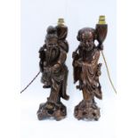 Two chinoiserie figural rootwood table lamp bases, 43cm (2)