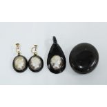 Whitby Jet to include a locket, pendant and pair of drop earrings with cameo panels, (4)