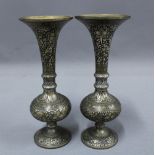 A pair of Indian metal vases, 24cm (2)