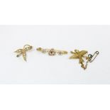 15ct gold bird brooch, 15ct gold seed pearl brooch and an unmarked yellow metal seed pearl and