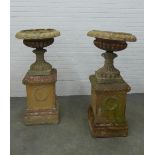 Pair of large garden urns on stands. (one is A/F) 123 x 58cm. (2)