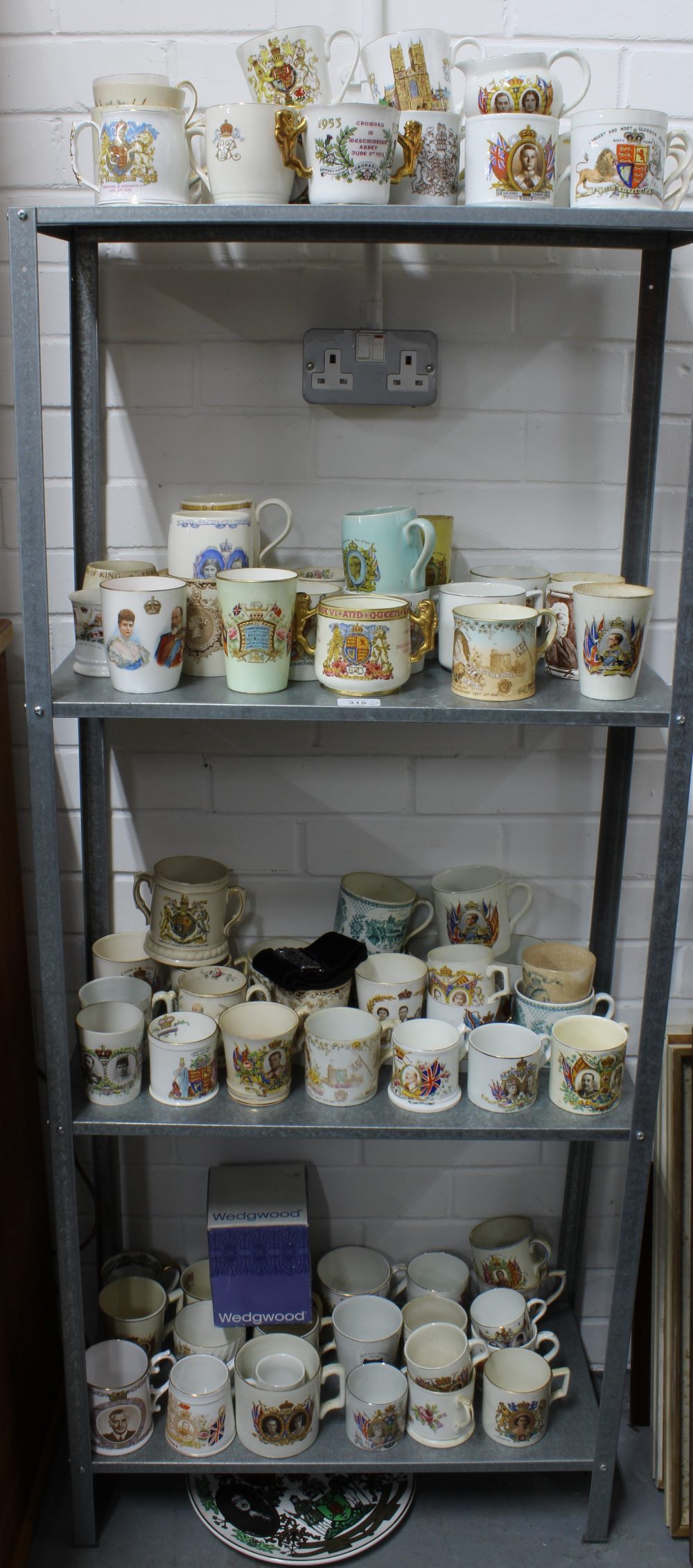A large collection of royal commemorative mugs, (over four shelves)