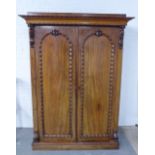 19th century mahogany two door wardrobe with stepped cornice over two panelled doors, the interior