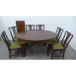 Mahogany dining suite comprising table with oval top and gadrooned edge with extending leaf, on ball