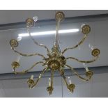Large & heavy Dutch style brass chandelier, ten scrolling arms with octagonal scones and candle