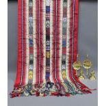 Embroidered runner, fringed ends, 120 x 240cm and a pair of brass candlesticks, (3)