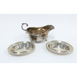 George V silver sauce boat, Sheffield 1915 and a pair of 19th century silver dishes, London 1801,