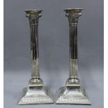 A pair of Epns Corinthian column candlesticks, detachable scones and weighted base, 32cm tall (2)