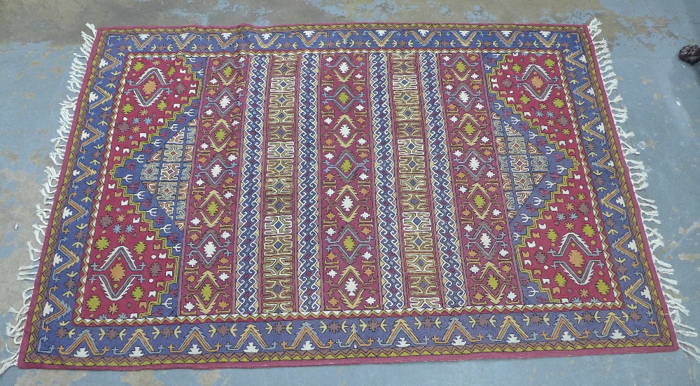 Indian made Kilim rug with blue and red field. 233 x 151cm.