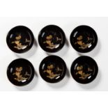 A SET OF SIX LACQUERED PLATES WITH DAIKON