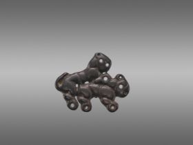 AN ORDOS BRONZE 'COPULATING TIGERS' PLAQUE, WARRING STATES
