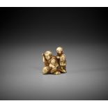 ONO RYOMIN II: A FINE AND AMUSING IVORY NETSUKE OF THREE BOYS AT PLAY