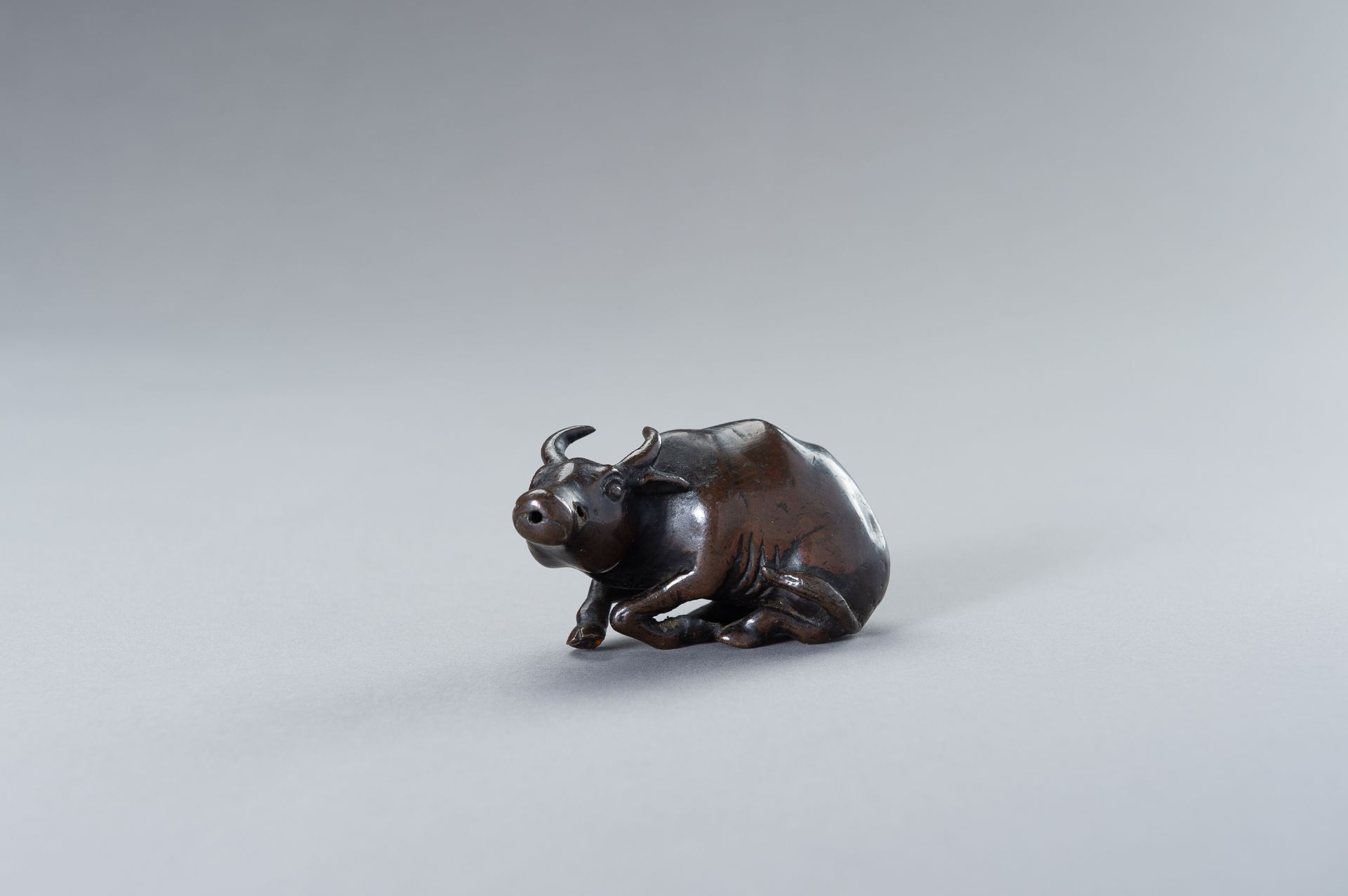 A CHINESE BRONZE FIGURE OF A WATER BUFFALO - Image 2 of 10