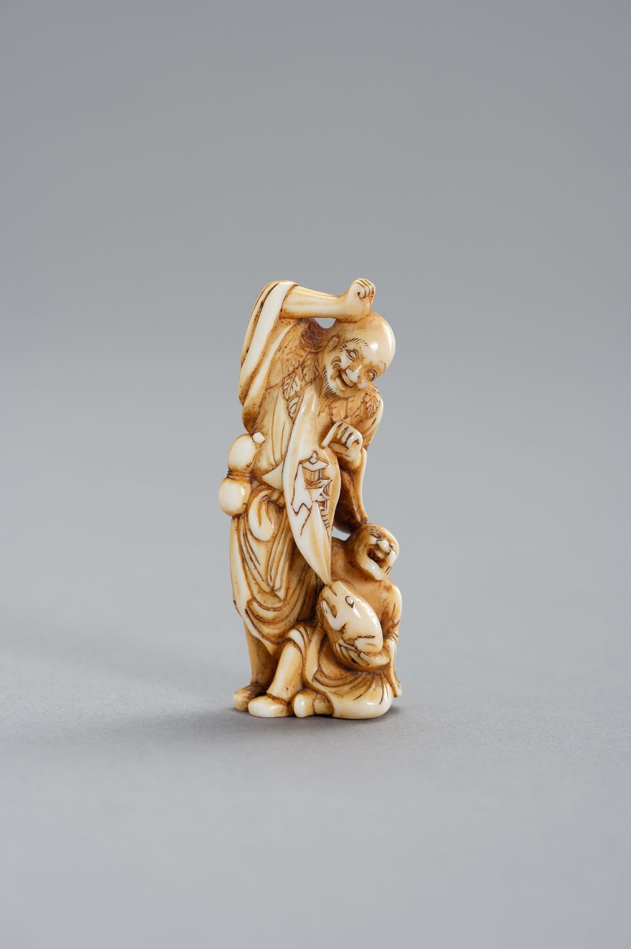 A RARE IVORY NETSUKE OF TWO SENNIN