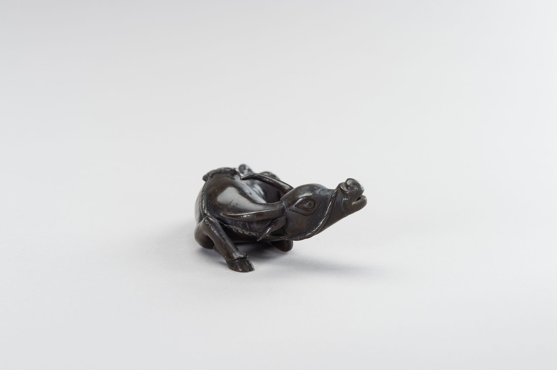 A CHINESE BRONZE FIGURE OF A TAMED WATER BUFFALO - Image 7 of 11