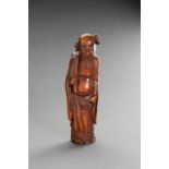 A CARVED BAMBOO FIGURE OF AN IMMORTAL