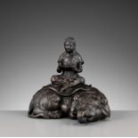 SHIUN: A FINE BRONZE OKIMONO OF FUGEN BOSATSU SEATED ON AN ELEPHANT