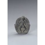 A GRAY SHIST PLAQUE OF A FERTILITY GODDESS