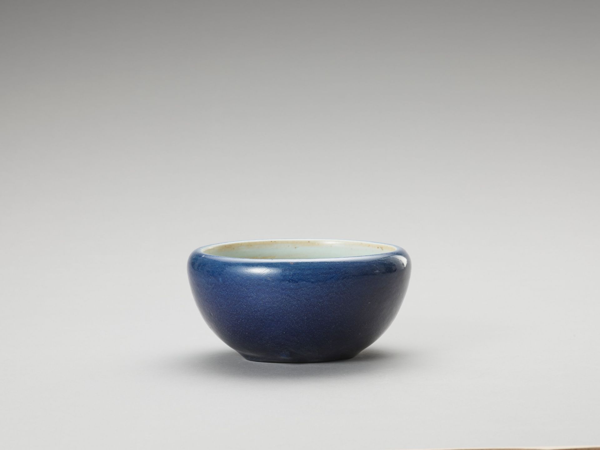 A MONOCHROME, BLUE-GLAZED PORCELAIN BOWL