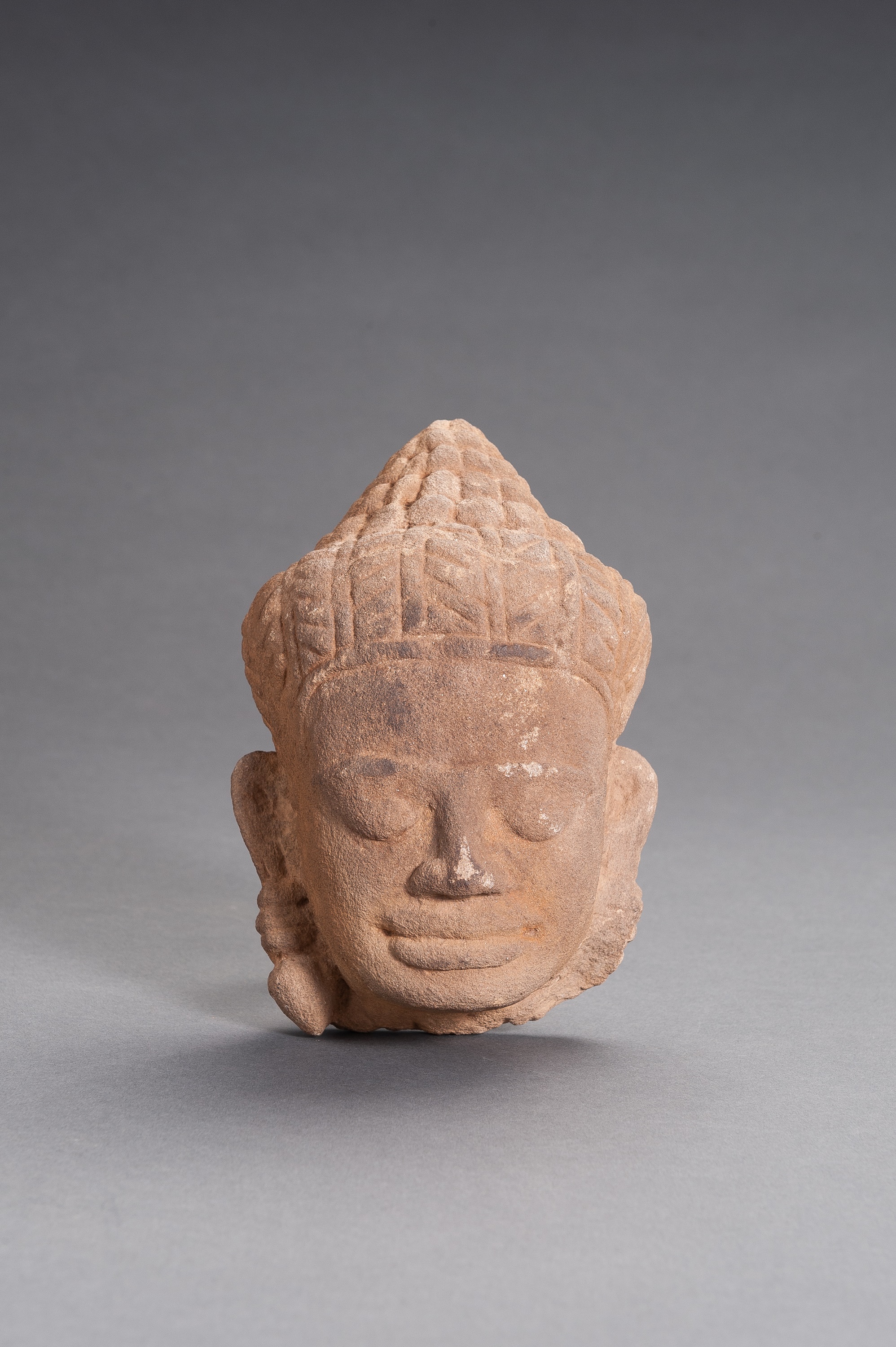 A KHMER SANDSTONE HEAD OF BUDDHA