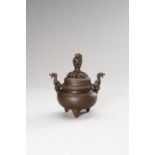 A BRONZE TRIPOD CENSER WITH DRAGONS