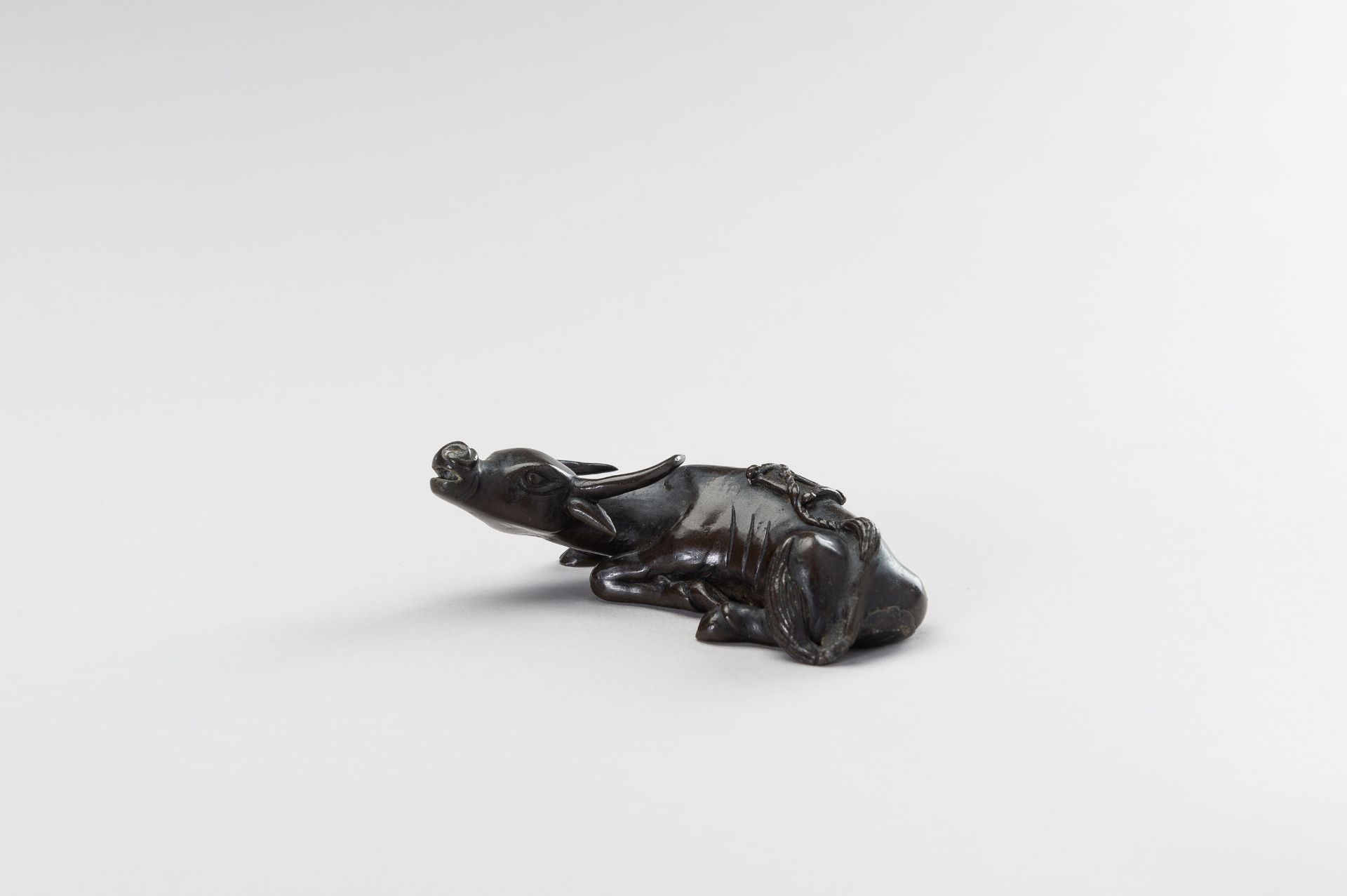 A CHINESE BRONZE FIGURE OF A TAMED WATER BUFFALO - Image 3 of 11