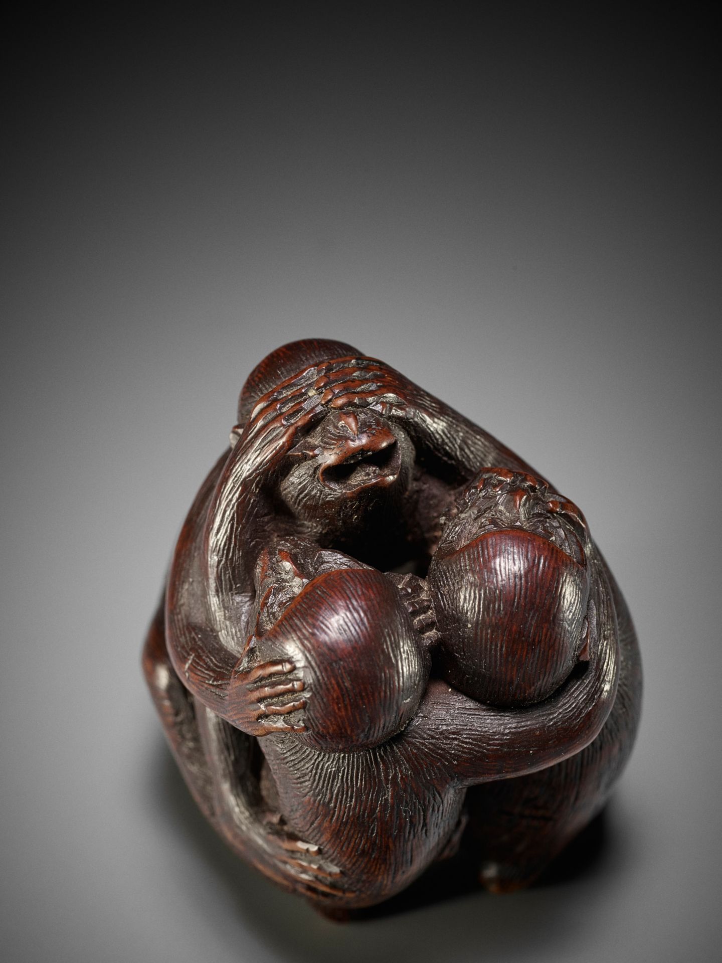 SHUGETSU: A FINE WOOD NETSUKE OF THE SAMBIKI SARU (THREE WISE MONKEYS)