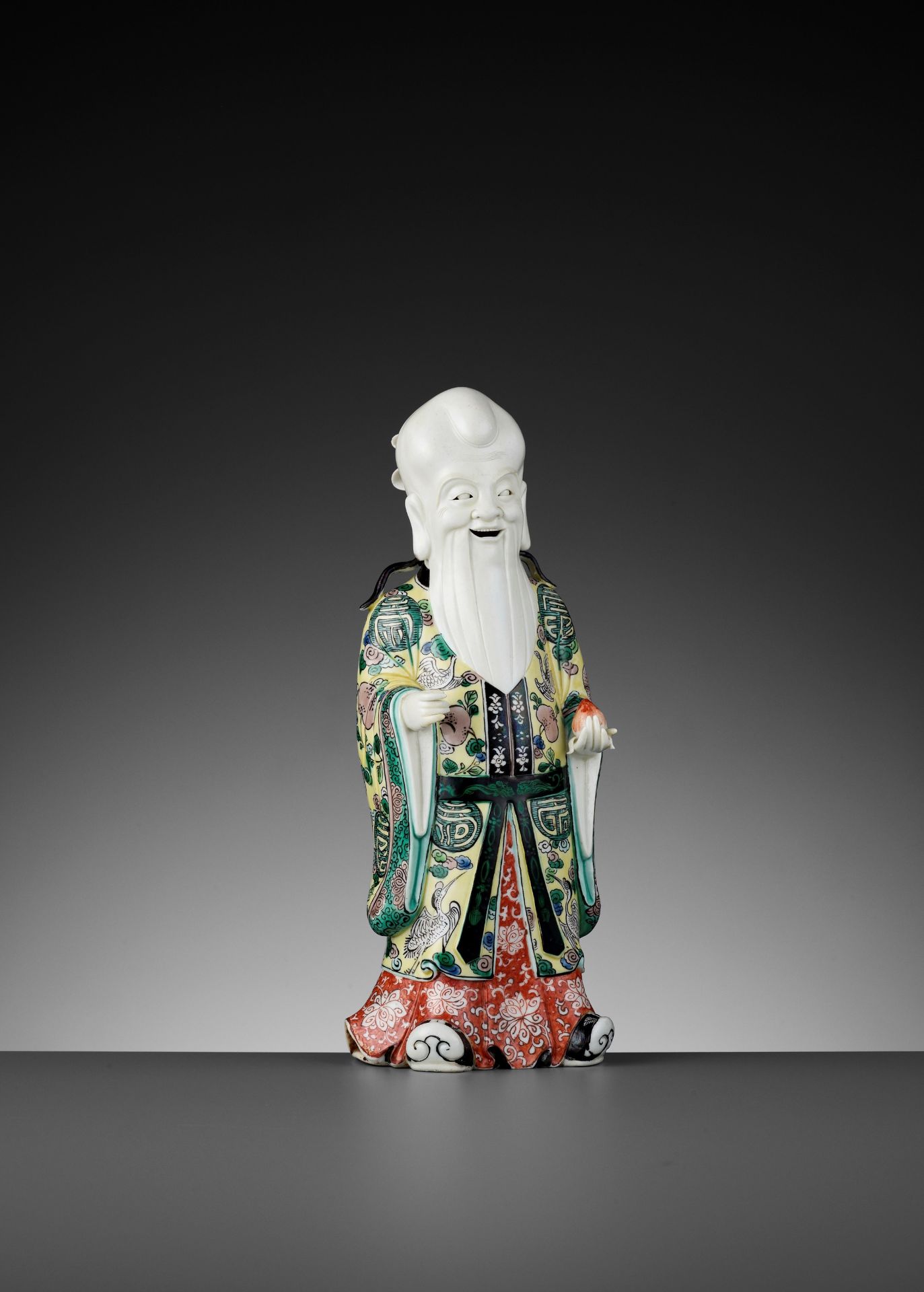 A FAMILLE VERTE BISCUIT FIGURE OF SHOULAO, QING DYNASTY