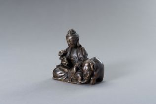 A BRONZE FIGURE OF GUANYIN WITH ELEPHANT