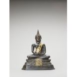 A HEAVY THAI PARCEL-GILT BRONZE OF BUDDHA