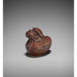 REIGEN: A WOOD NETSUKE OF A DRAGON HATCHLING