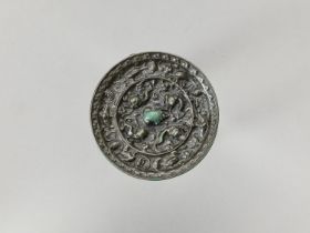 A BRONZE 'LION AND GRAPEVINE' MIRROR, FIVE DYNASTIES
