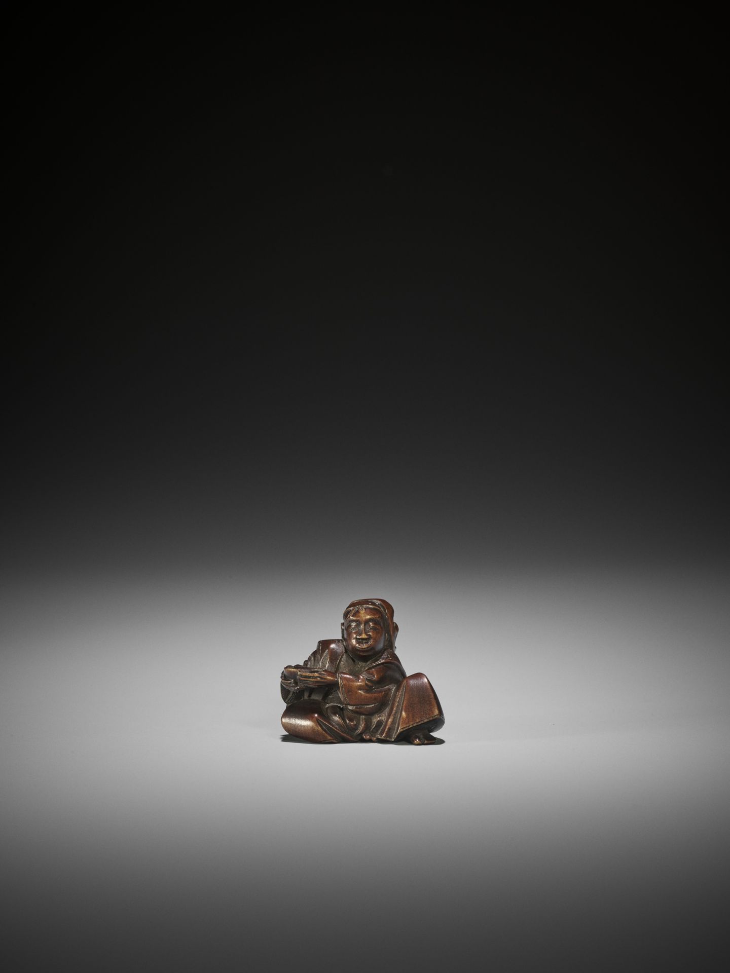 MASAYUKI: AN AMUSING WOOD NETSUKE OF A DRUNK ACTOR