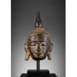 A LARGE GILT AND BLACK-LACQUERED HEAD OF BUDDHA, AVA STYLE