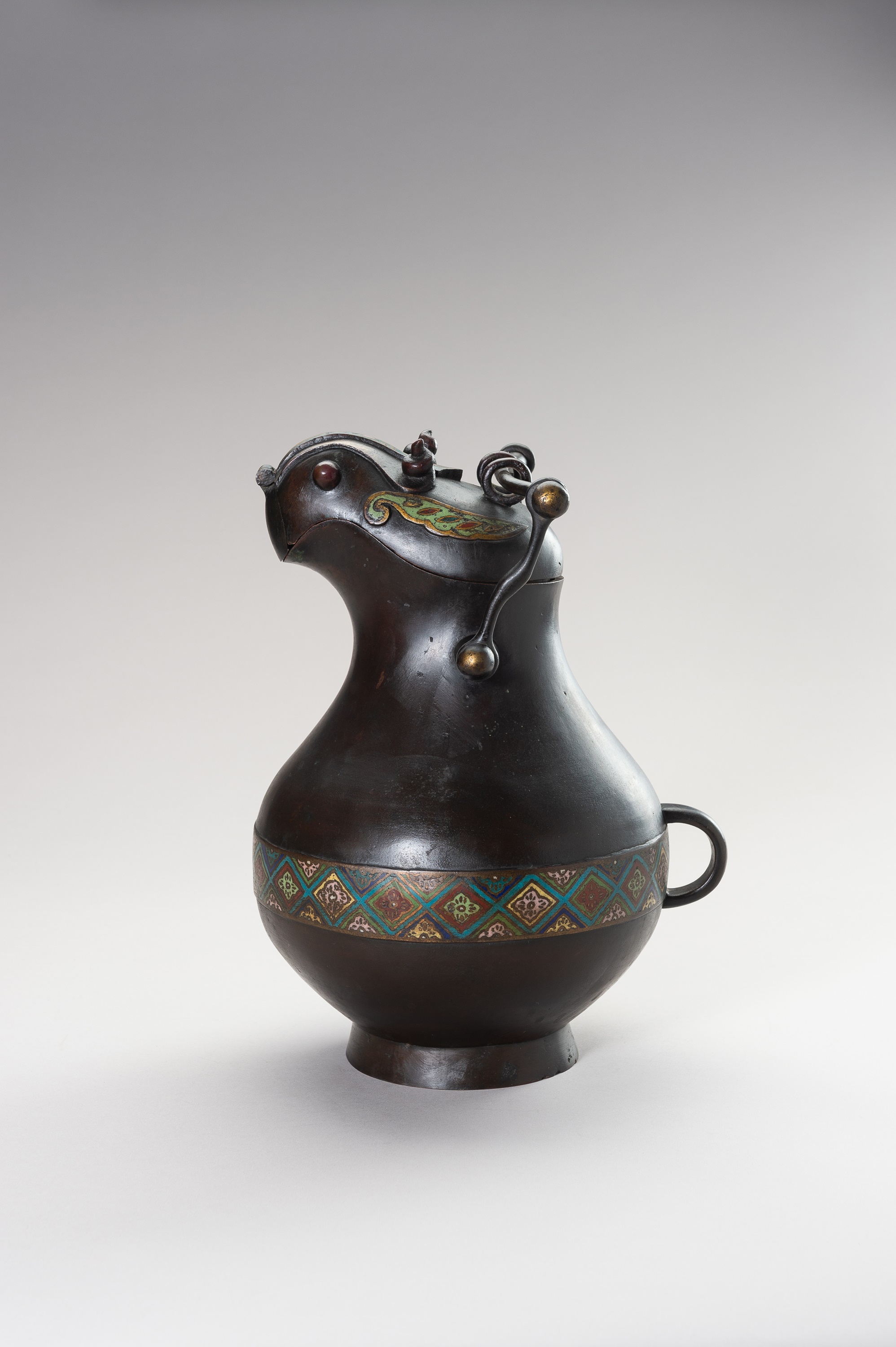 AN ARCHAISTIC ZOOMORPHIC BRONZE AND CLOISONNE WINE VESSEL HU