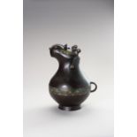 AN ARCHAISTIC ZOOMORPHIC BRONZE AND CLOISONNE WINE VESSEL HU