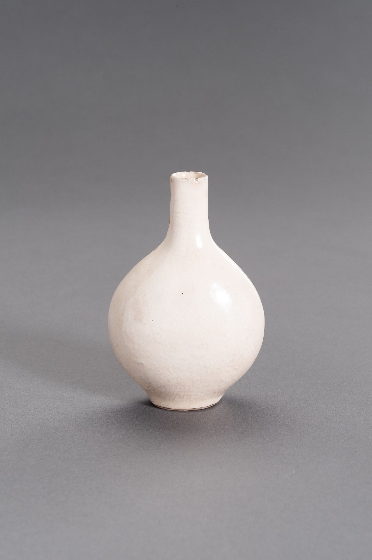 A MOLDED AND CREAM-GLAZED CERAMIC FLASK, MING DYNASTY - Image 2 of 9