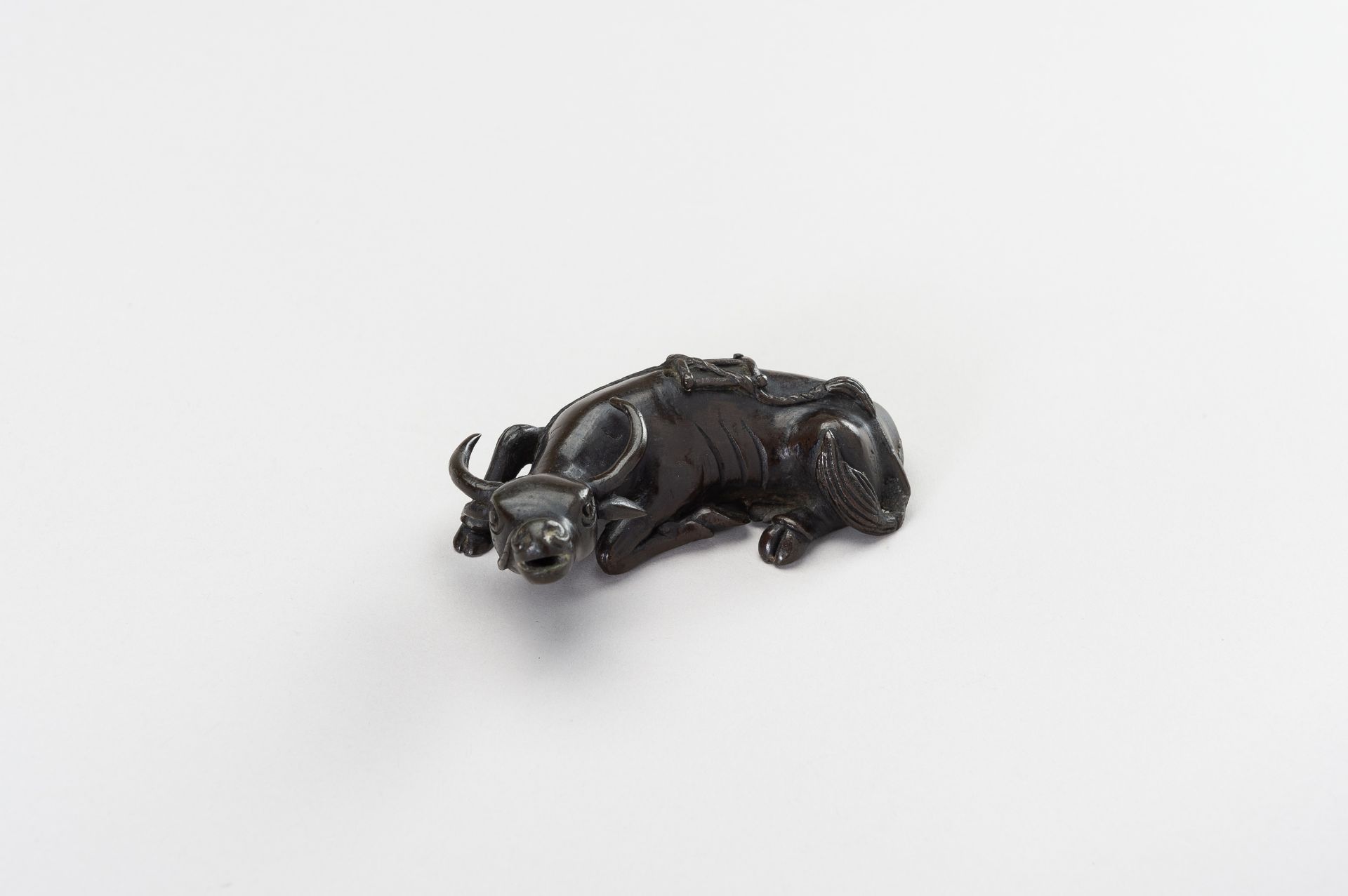 A CHINESE BRONZE FIGURE OF A TAMED WATER BUFFALO - Image 8 of 11