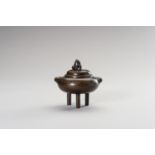 A SILVER-INLAID MINIATURE BRONZE TRIPOD CENSER