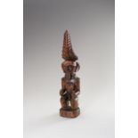 A WOOD FIGURE OF A MALE ANCESTOR (ADU ZATUA)