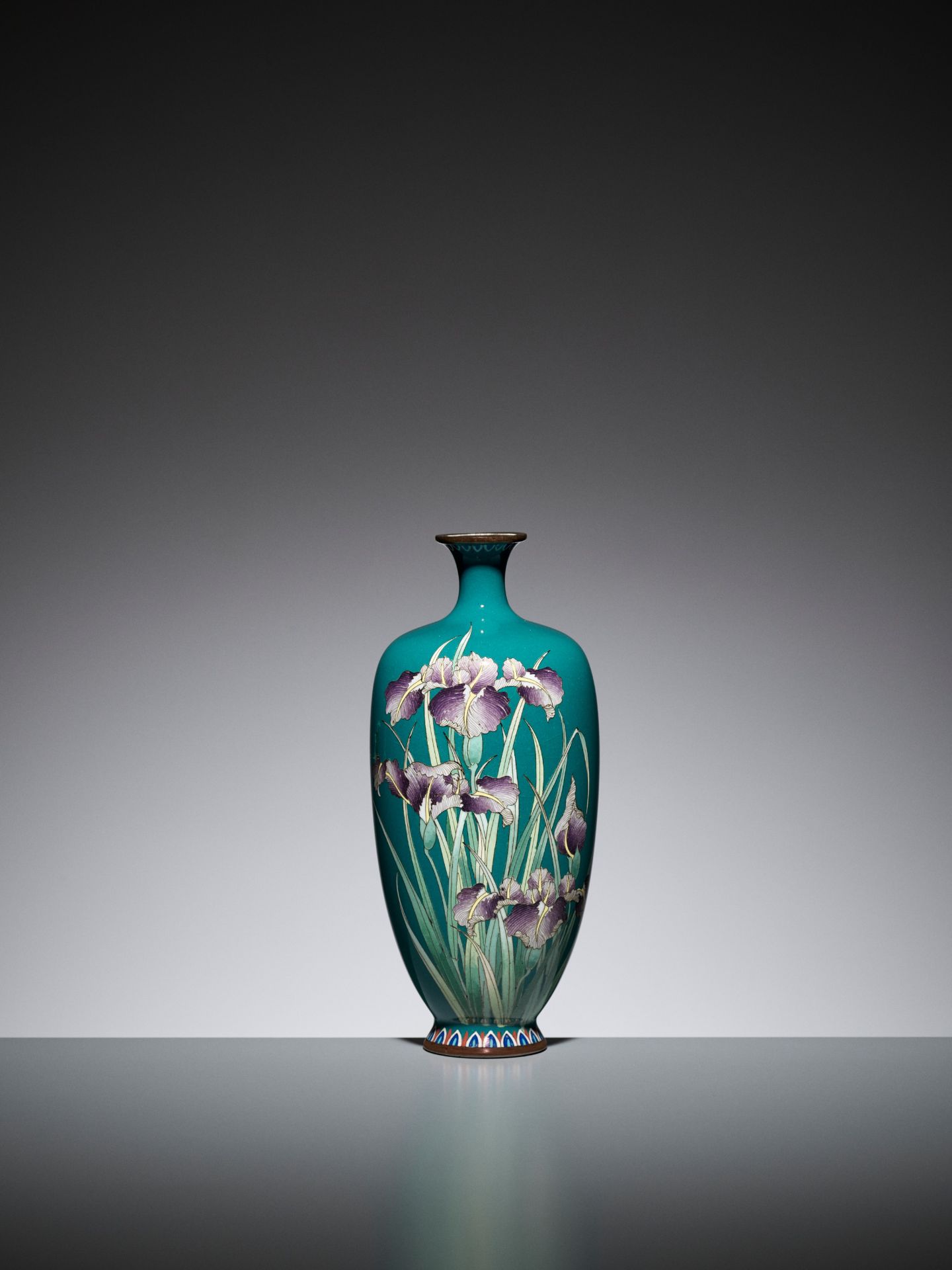 A TURQUOISE CLOISONNE ENAMEL VASE WITH IRIS